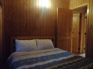 Postel nebo postele na pokoji v ubytování Cabaña piedra azul