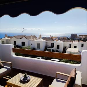 a balcony with a view of a city at Port Royale Los Cristianos Arona in Los Cristianos