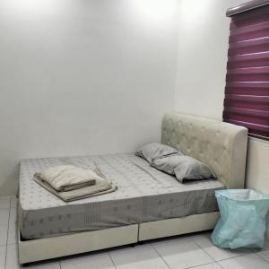Postel nebo postele na pokoji v ubytování Townhouse, Kita Bayu, Cybersouth