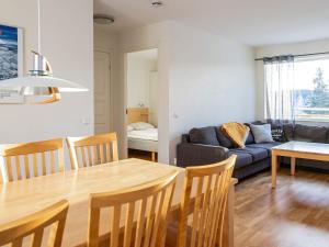 een woonkamer met een tafel en een bank bij 8 person holiday home in LOFSDALEN in Lofsdalen