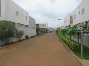 an empty street in a city with buildings at 2 Bedroom Duplex House - 3 Bathrooms, Balcony , Kitchen, Living Room, - 24 7 Security, Gated, Gym, Pool, Wifi, DSTV, in Tema