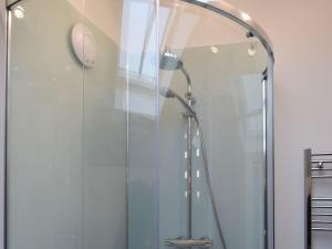 a shower in a bathroom with a glass door at Five Barred Gate Barn in Inglewhite