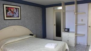 Łóżko lub łóżka w pokoju w obiekcie Hotel Mediterraneo Arequipa