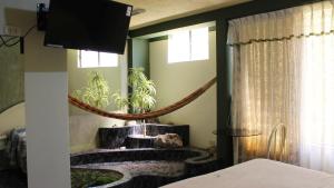 a bedroom with a tv and a sink in a room at Hotel Mediterraneo Arequipa in Arequipa +76 photos