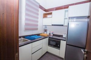 Kuchnia lub aneks kuchenny w obiekcie Qlets Privé