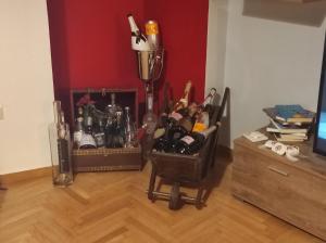 a room with a bunch of bottles on a wooden floor at ATHENS RIVIERA SEA VIEW APARTMENT in Piraeus