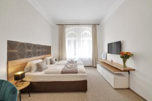 Postel nebo postele na pokoji v ubytování Rezidence Villa Gloria