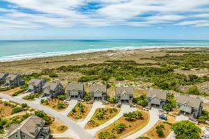 an aerial view of a row of houses on the beach at Beach Blessings in Topsail Beach