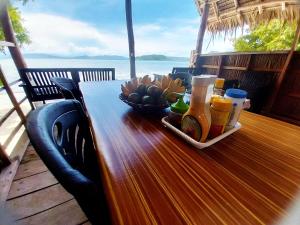 a table with a tray of drinks and a bowl of food at Aldejus Homestay in Yennanas Besir