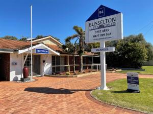 a sign in front of a house at Busselton Jetty Chalets in Busselton