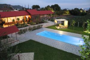a swimming pool in the yard of a house at Villa Vitis in Kvareli