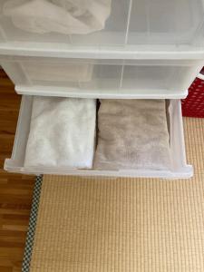 a drawer in a refrigerator with two towels at 短期賃貸ビッグバーンズマンション田上 in Kagoshima +23 photos