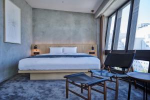 Rúm í herbergi á The Tower Hotel Nagoya