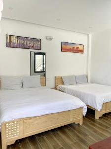 Postel nebo postele na pokoji v ubytování Dalat Topview Homestay