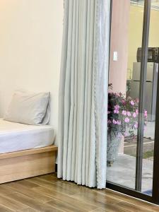 Postel nebo postele na pokoji v ubytování Dalat Topview Homestay