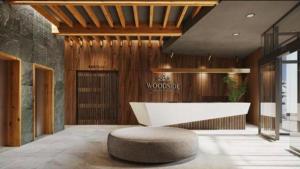 a lobby with a white table and a bench at Woodside Kopaonik Residences in Kopaonik