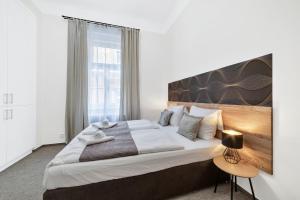 Postel nebo postele na pokoji v ubytování Rezidence Villa Gloria