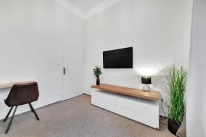 TV a/nebo společenská místnost v ubytování Rezidence Villa Gloria