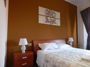 A bed or beds in a room at Camurria Sicilian B&B