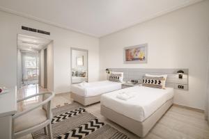 A bed or beds in a room at Sindbad Club