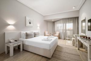 A bed or beds in a room at Sindbad Club