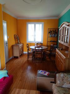 a living room with a table and a dining room at Room Algo in Algolsheim +7 photos