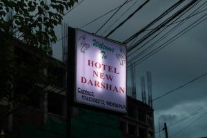Un certificado, premio, letrero u otro documento en Hotel New Darshan