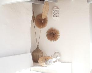 a shelf with a vase and other items on it at Sea'Ya Thoughtful Stays - Villas in Cascais