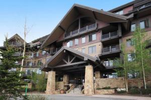 a large apartment building with a large balcony at Crystal Peak Lodge 3 Bedroom Ski In, Ski Out Slopeside Condo At The Base Of Peak 7 in Breckenridge