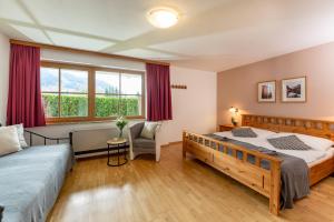 Ein Bett oder Betten in einem Zimmer der Unterkunft Landhaus Bergner Alm