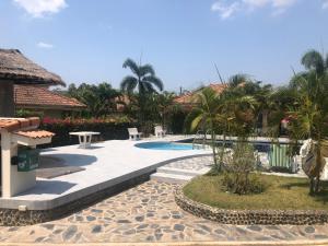 a resort with a swimming pool and palm trees at Hua Hin in Hua Hin