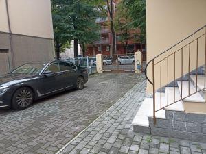 a black car parked next to a building at Casa Gramsci in Modena