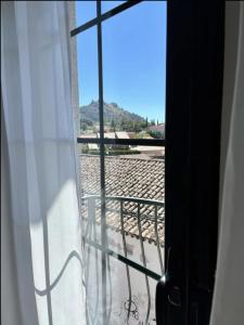 a view from a window with a view of a beach at Apartamentos El Piquillo en Cadalso de los Vidrios in Cadalso de los Vidrios