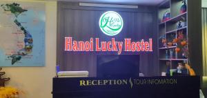 a sign for a harvard luxury house reception at Hanoi Lucky Hostel in Hanoi