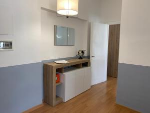 a room with a desk in the corner of a room at B&S Home Vaticano in Rome +1 photo