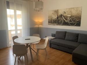 a living room with a table and a couch at B&S Home Vaticano in Rome