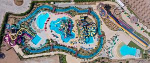 an overhead view of a water park with a roller coaster at Blend Club Aqua Resort in Hurghada