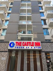 a building with a castle inn sign in front of it at The Castle Inn in Dhaka