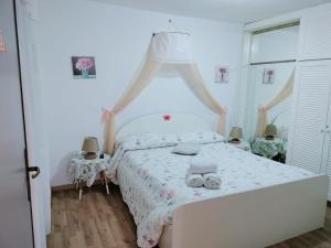 Posteľ alebo postele v izbe v ubytovaní ControVento Apartament II