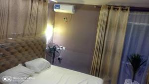 Ein Bett oder Betten in einem Zimmer der Unterkunft 3 Bedrooms house for Short let Holiday Apartments