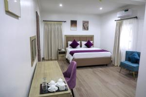 Postel nebo postele na pokoji v ubytování Quest Boutique Hotel