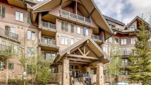 a large apartment building with a large balcony at Crystal Peak Lodge 4 Bedroom Ski In, Ski Out Slopeside Condo At The Base Of Peak 7 in Breckenridge
