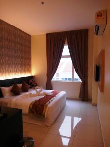 Postel nebo postele na pokoji v ubytování Supreme Hotel