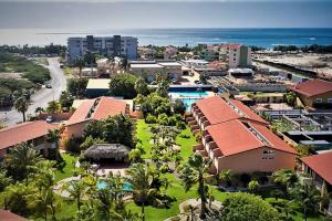 an aerial view of a resort with the ocean at Luxury two-bedroom townhome in few steps from Eagle Beach in Palm-Eagle Beach