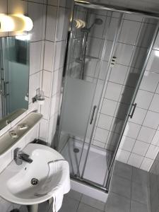 a bathroom with a sink and a shower at Hotel Rheinlust in Boppard