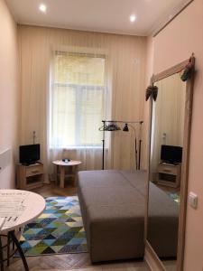 Televízia a/alebo spoločenská miestnosť v ubytovaní Apartament at Park
