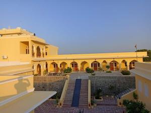 a view of a building from a balcony at Fort Chabariya in Kekri