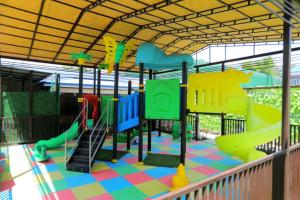 a playground with a slide at Shosh Garden Family Resort in Chorwoq