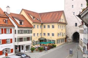 a group of buildings on a street in a town at Hotel Obertor in Ravensburg