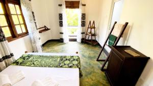 Postel nebo postele na pokoji v ubytování Madiha Surf House Lanka